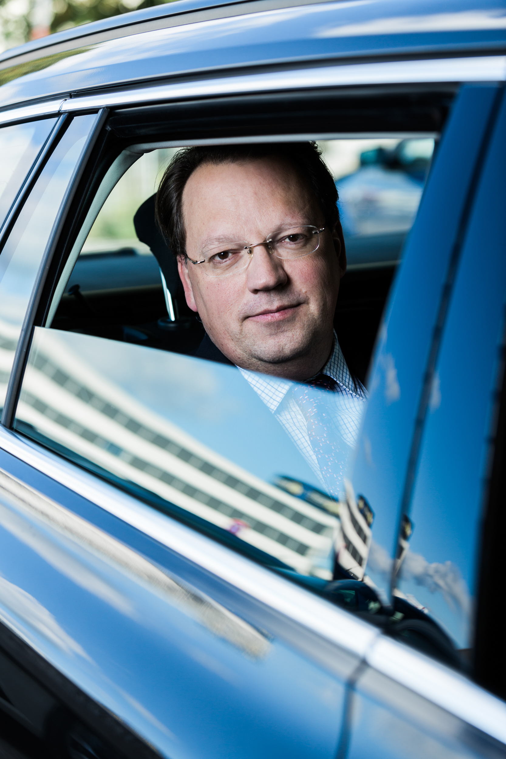 Corporate portrait of a guy in a car